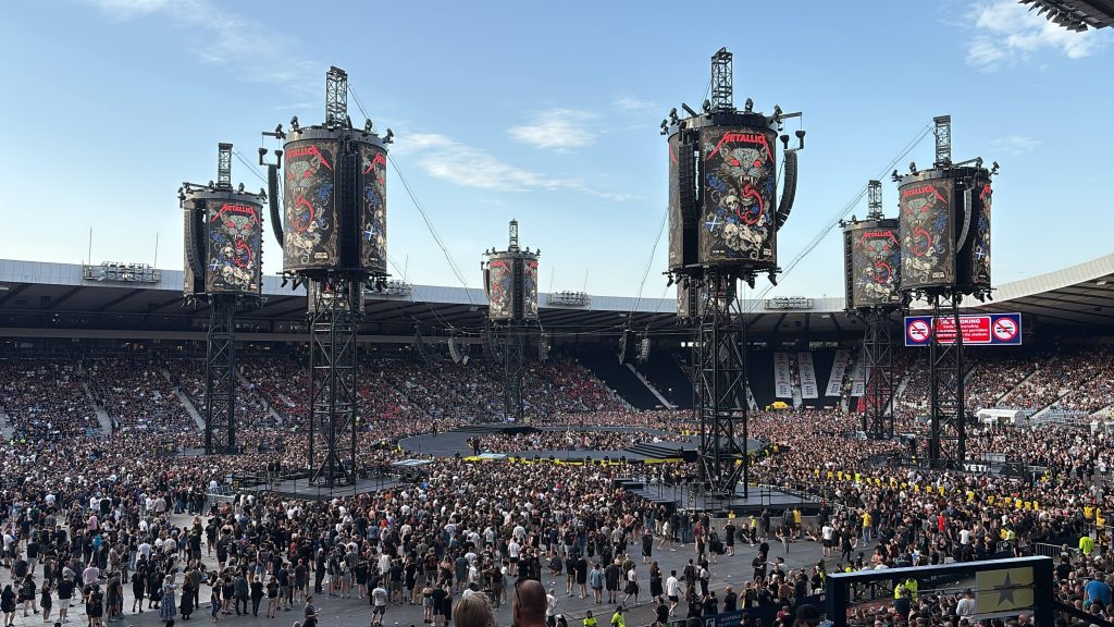 Print management at Hampdem Stadium with Metallica fans watching the stage