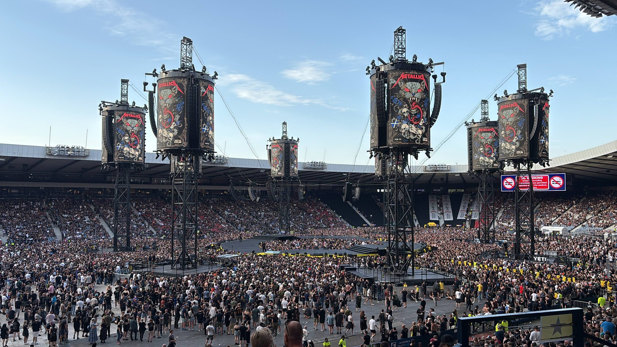 Print management at Hampdem Stadium with Metallica fans watching the stage